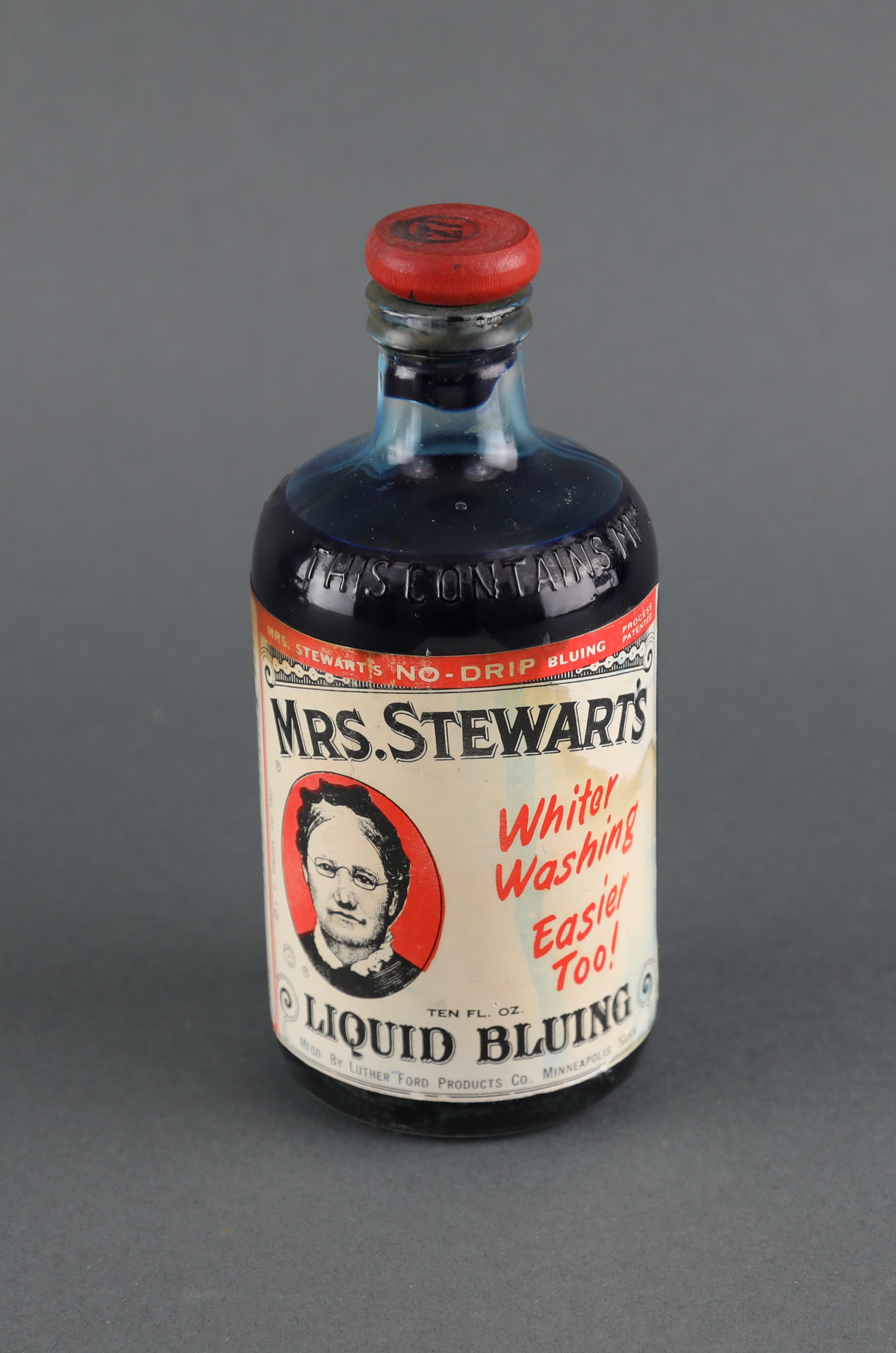 C1920s This Contains Mrs. Stewart's Bluing, Cork Top Aqua Glass