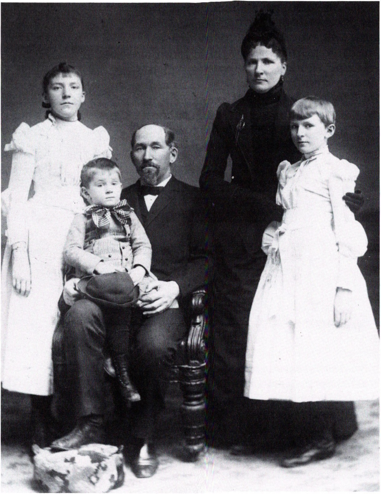 Ada Comstack (left) with her family as a young girl